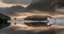 Mist and Reflections Crummock Water Cumbria by Tony Bennett 