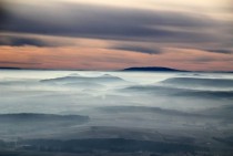 Mist covers the hills in Harzvorland Germany 