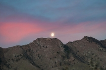 Moon set over a sunrise - Death Valley CA 
