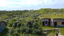 More overgrown bunkers just past the sand of the beaches of Normandy 