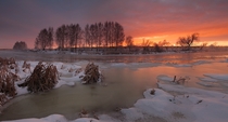Morning light on the partially frozen Miass River Russia 