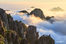 Mountain Huangshan of Anhui China at sunrise Mt Huangshan is famous for its sunrise and sea of clouds 