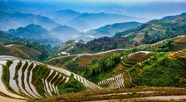Mountaintop village in Longsheng China surrounded by rice terraces 