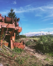 Mt St Helens watching over some abandoned farm equipment