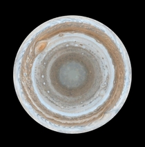 Multiple Cassini images combined to show the entirety of Jupiters illuminated south pole 