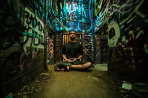 My friend meditating in the cages of the abandoned LA zoo 