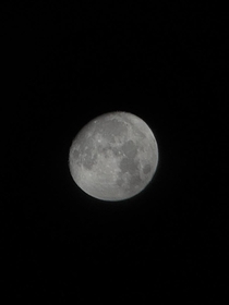 My new best photo of the moon Not gorgeous but taken with a phone and a pair of binoculars 