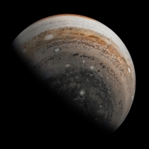NASAs Juno caputures Jupiters southern hemisphere as the spacecraft sped away after a Nov   close flyby Theres massive cyclones near Jupiters south pole as well as the chaotic clouds of the folded filamentary region  the area between the orange band and t