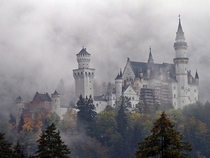 Neuschwanstein castle through mist Germany 
