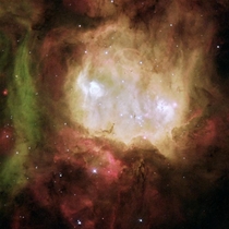 Nicknamed The Ghost Head Nebula NGC  is a star-forming region in a nearby galaxy the Large Magellanic Cloud The nebulas two bright eyes are blobs of hydrogen and oxygen that glow with the energy from massive newborn stars NASAESA