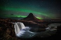 Northern lights dancing over Kirkjufell mountain Iceland 