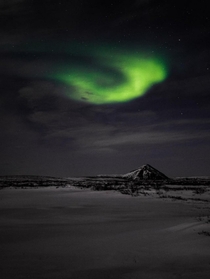Northern lights over a little volcano in Iceland  - IG glacionaut