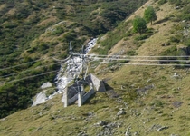 Not sexy but interesting stone walls to protect transmission towers from alpine avalanches Lukmanierpass Switzerland 