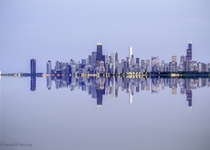 Oh the Reflections - Chicago reflecting on a calm and silent Lake Michigan  by Piyush Pandey x-post rUnitedStatesofAmerica