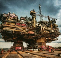 Oil rig being moved inland for decommissioning
