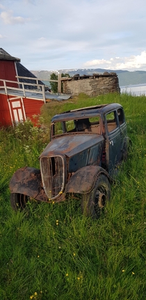 Old abandoned  Ford Model Y in a field somewhere in northern Norway