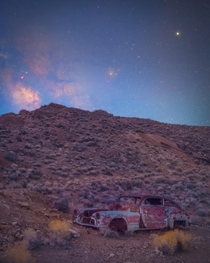 Old car near an abandoned mine under the stars and planet Jupiter Death Valley  I