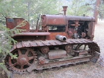 Old International Harvester TD dozer sitting in the woods 