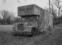 Old North American truck sits decaying in a field in Iowa shot with Fuji GSs Kodak Tmax 