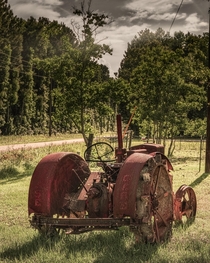 Old tractor sitting by the road