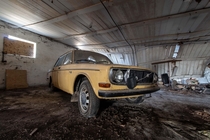 Old Volvo rotting in a barn 