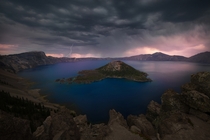 Ominous storm clouds gather as thunder rumbles over Crater Lake National Park OR 