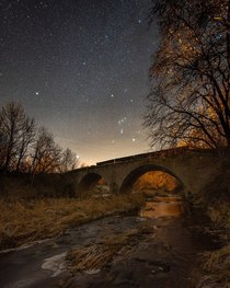 Orion constellation over the old bridge OC