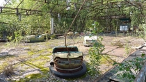 Overgrown bumper car court Pripyat Chernobyl Ukraine 