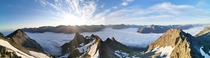 Panorama of an early morning above fjords covered in heavy fog Dalegubben Sb Hjrundfjord Norway 