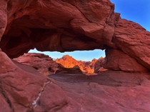Peaking through an arch at Valley of Fire Nevada 