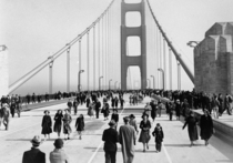 Pedestrians walk across the Golden Gate Bridge on opening day May   
