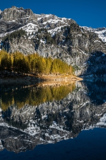 Perfect symmetry at lake Oeschinen Kandersteg Switzerland 