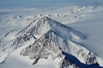 Photo of a mountain in Antarctica from the window of a Boeing  