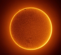Photo of the ISS passing through the Sun by Rainee Lee Tubbs