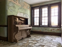 Piano in an abandoned New England state hospital