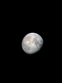Picture of the moon I took with my phone and and a  telescope I bought yeaterday