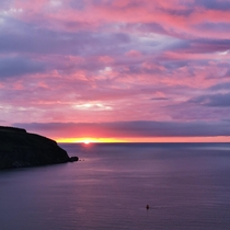 pinky purple hues during a lovely am sunrise in cromarty scotland 