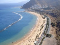 Playa Teresitas in Tenerife - yellow sand hauled from Sahara and artificial barrier built to prevent sea from stealing the sand 