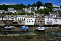 Polperro village England another view of the quaint harbor at low tide showing the wonderful architecture of this old smuggler town 