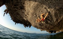 professional climber Jessa Younker in Thailand climbing over water 