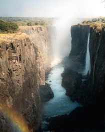 Rainbow emerging from the mist at Victoria Falls in Zambia  IG mvttmic