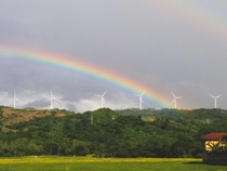 Rainbow over a windmill farm clicked in Rizal Philippines