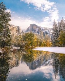Rare glimpse of Half Dome with fall colors and snow Yosemite National Park California 