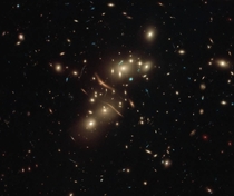 Recent Hubble image showing gravitational lensing in its image of galaxy cluster Abell 
