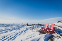 Red Chairs at Bakers Brook Gros Morne National Park Canada Ice as far as the eye can see 