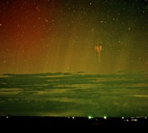 Red Sprite Lightning with Aurora in South Dakota -- A red sprite is a rarely seen form of lightning confirmed only about  years ago 