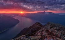 Red Star - sunset over the fjords of Sunndal Norway  by Haakon Nygaard