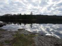 Reflection of the clouds on calm clear water Western Boundary Waters Minnesota 