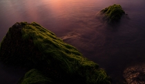 River rocks at sunset looking like mountains in mist Merritt Island Florida 