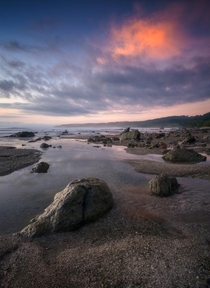 Rocks and colorful skies at the beach in Malpais Costa Rica 